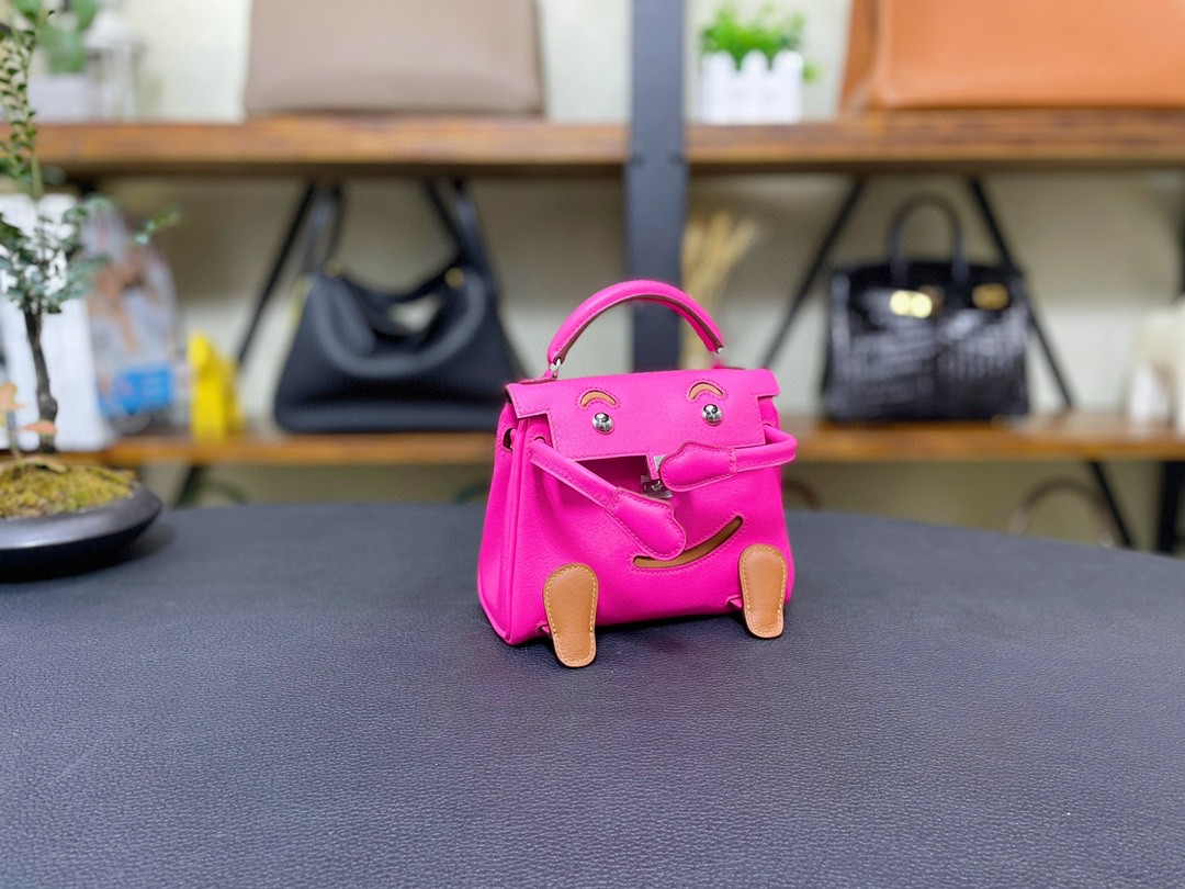 Hermès（爱马仕）Kelly doll 娃娃包 swift 玉兰粉 拼 金色 银扣 16cm